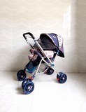 STAR & DAISY reversible baby stroller pram with mosquito net, reclining seat, reversible handle, safety harness, adjustable canopy, and comfortable travel support for babies.