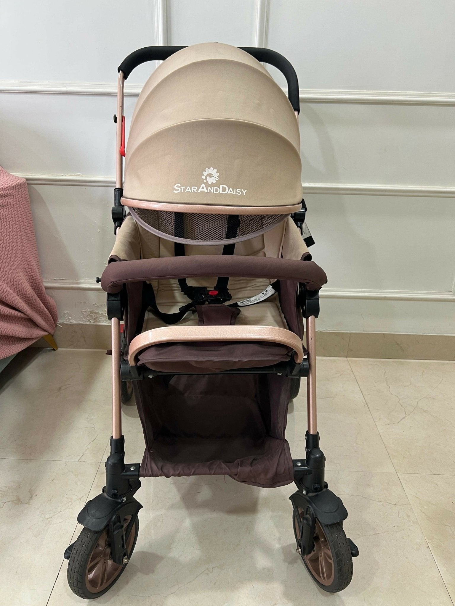 StarAndDaisy foldable baby stroller travel pram with reclining seat, sturdy wheels, safety harness, adjustable canopy, and compact foldable design for comfortable baby travel.