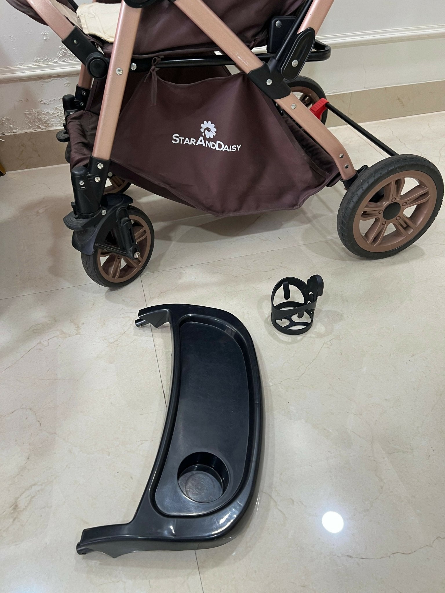 StarAndDaisy foldable baby stroller travel pram with reclining seat, sturdy wheels, safety harness, adjustable canopy, and compact foldable design for comfortable baby travel.