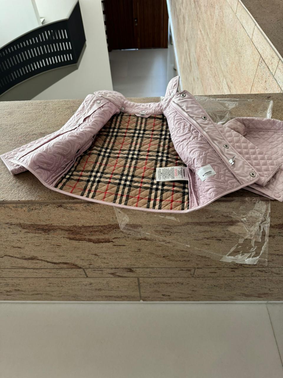 Dress your little fashionista in luxury with the Stylish Burberry Jacket with Detachable Hood - iconic style for every precious moment!