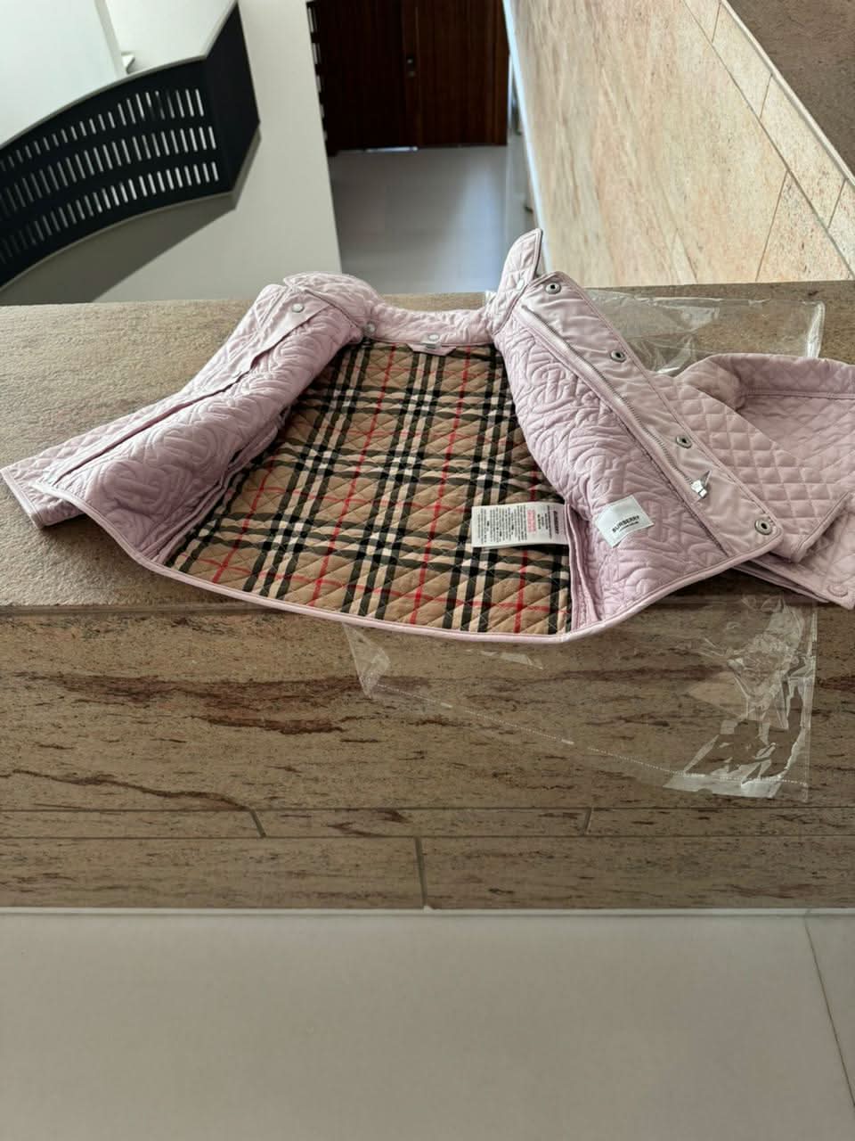 Dress your little fashionista in luxury with the Stylish Burberry Jacket with Detachable Hood - iconic style for every precious moment!