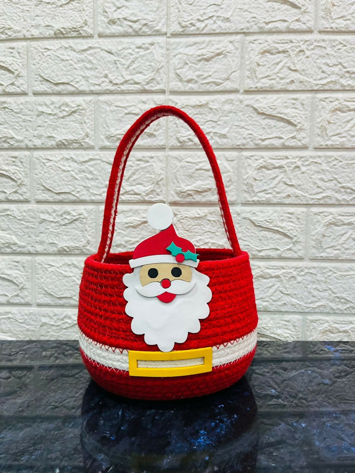Red woven basket with a Santa Claus face