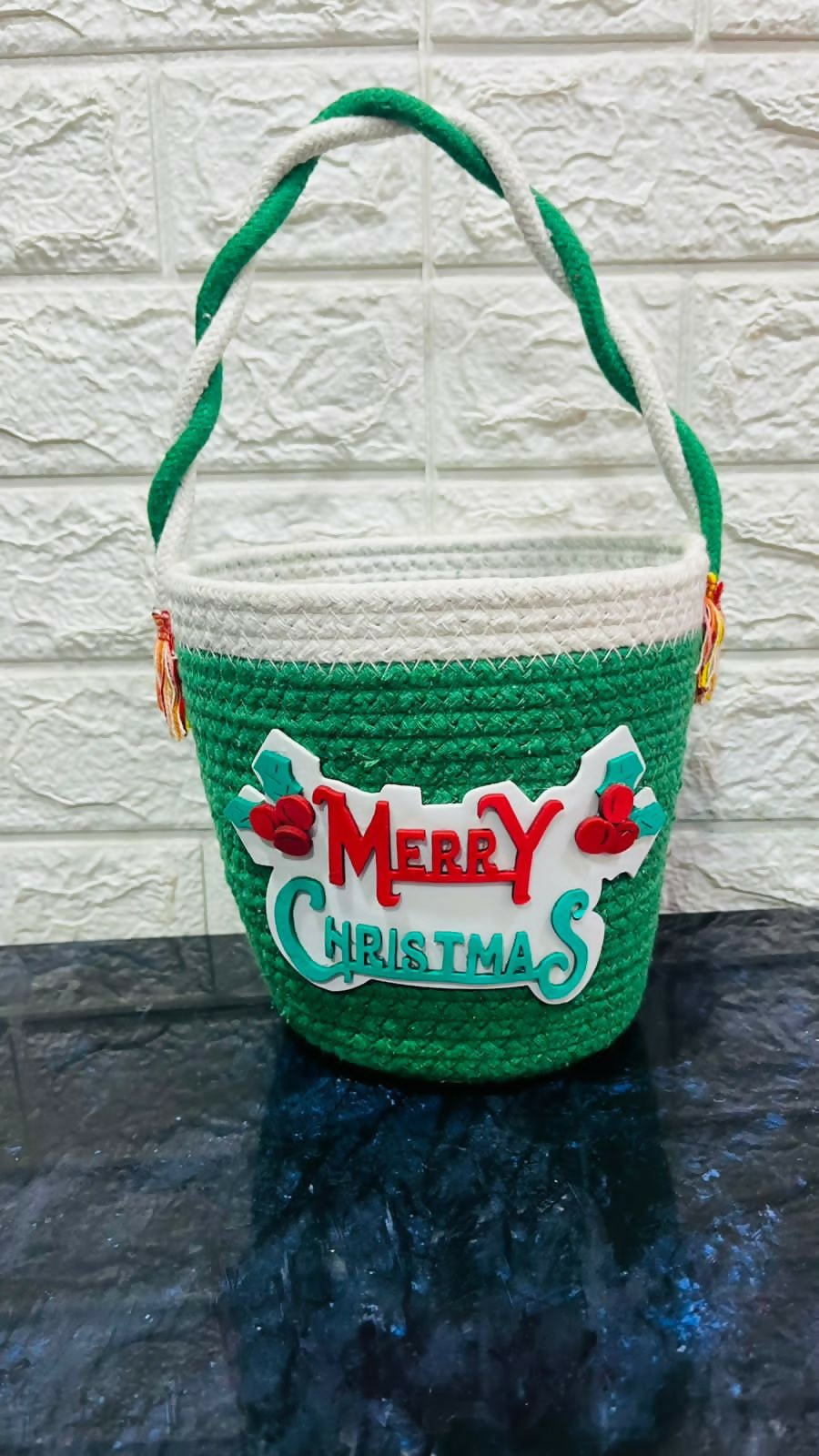 Green woven basket with 'Merry Christmas'