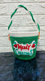 Green woven basket with 'Merry Christmas'