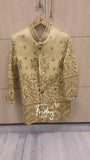 Light green embroidered blouse on a hanger with 'Friday' text on a wooden background