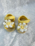 Crochet baby booties with flower