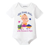White baby onesie with colorful graphics and text