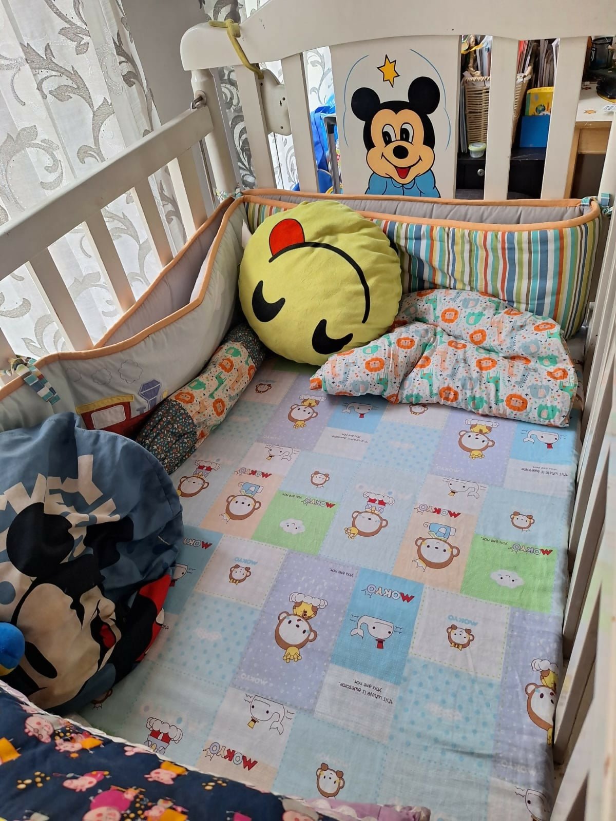 Wooden baby crib with storage, mattress, and bumper featuring sturdy wooden construction, spacious sleeping area, built-in storage, protective bumpers, and comfortable support for babies.