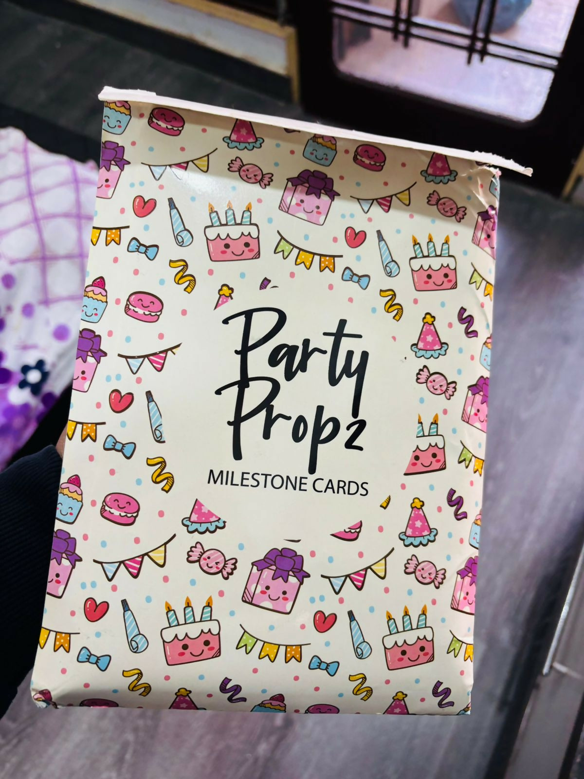 Pack of milestone cards with colorful party-themed design