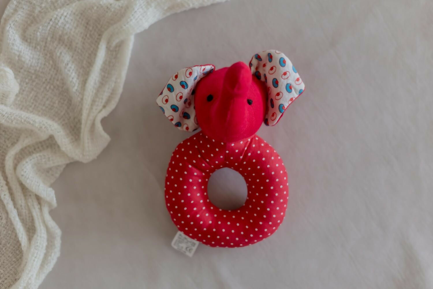 Introducing our Elephant Faced Shape Rattle, a delightful and eco-conscious sensory toy crafted with care and consideration.