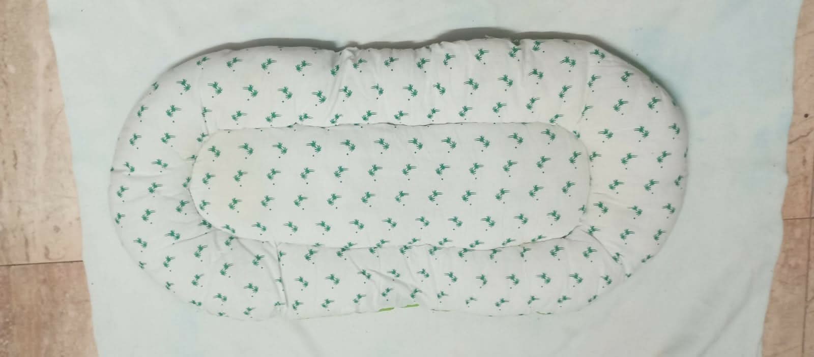 Soft and portable baby bed for newborns – perfect for home or travel.