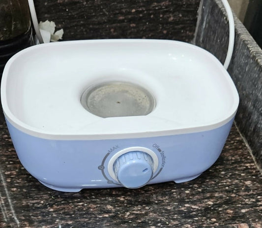 Blue and white appliance on a dark countertop