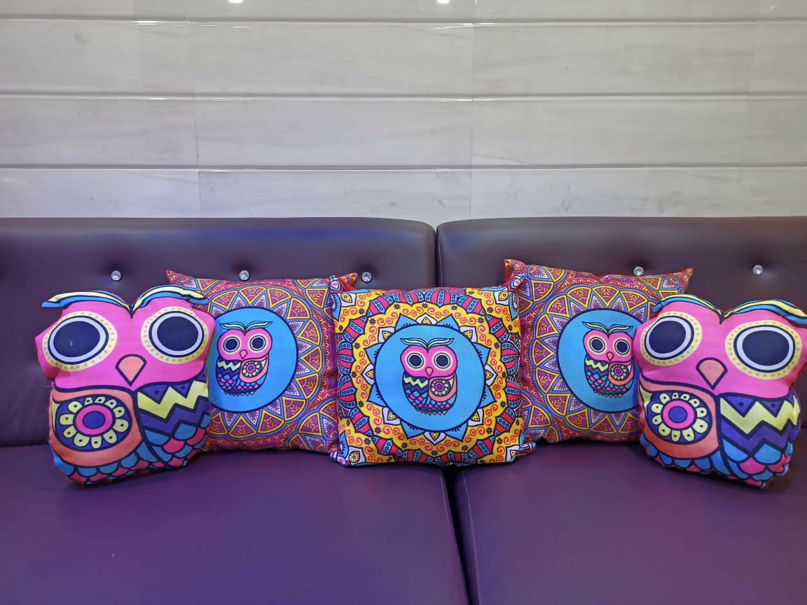 Colorful owl-themed cushions
