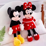 Plush toys resembling Mickey and Minnie Mouse