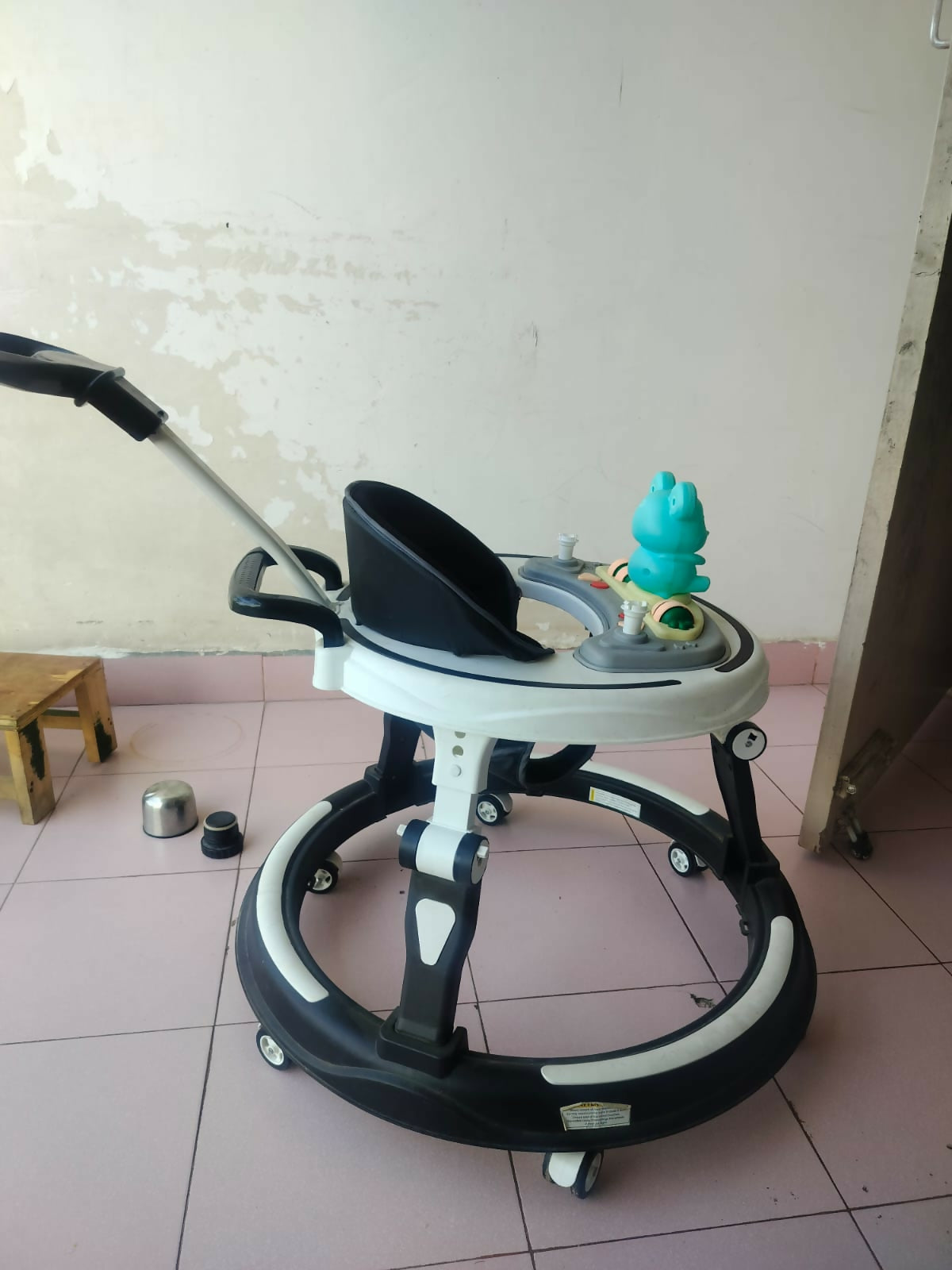 StarAndDaisy 3-in-1 baby walker with parent handle and musical tray, almost new condition