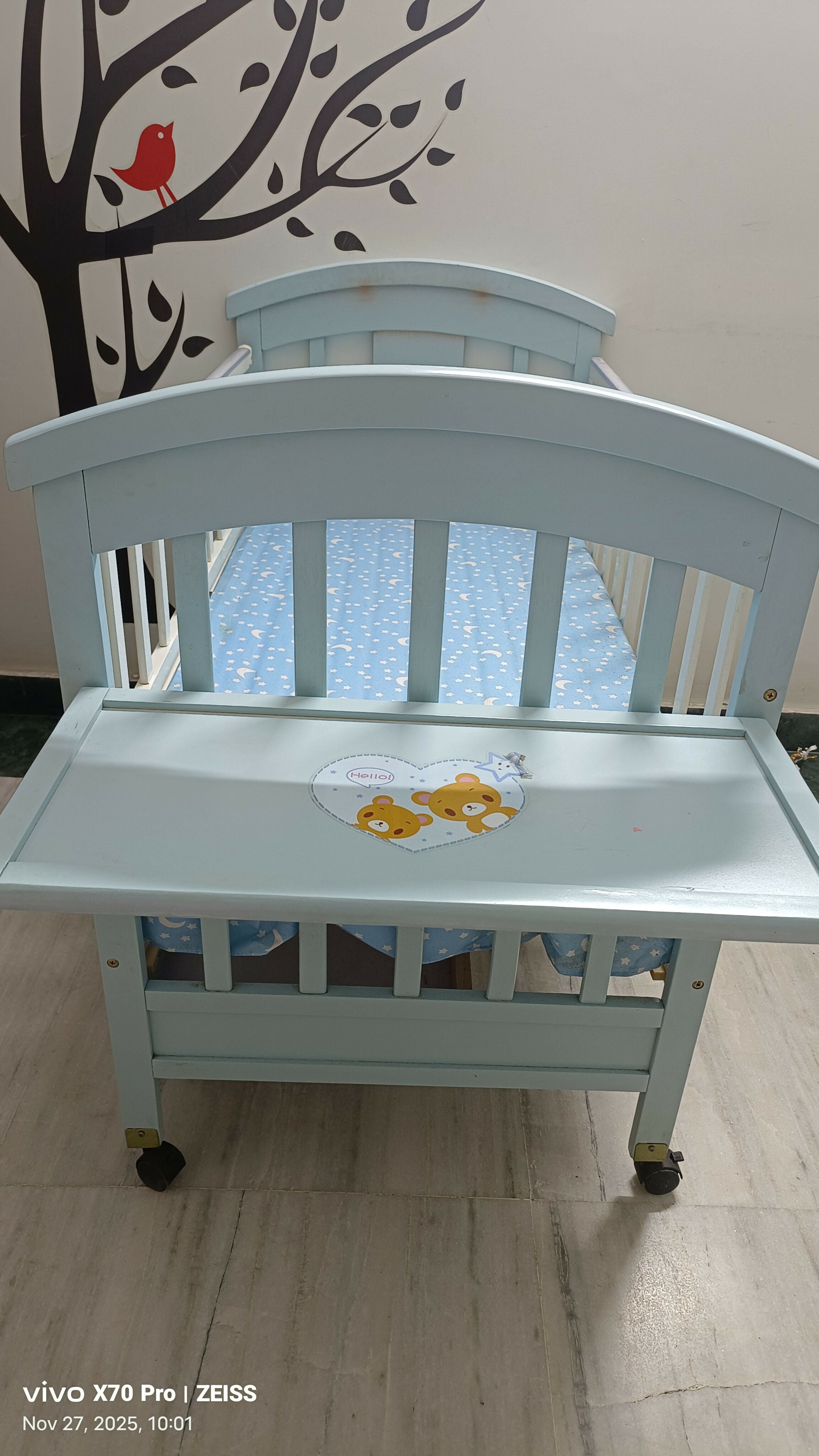 Blue baby cot with mattress and side protector