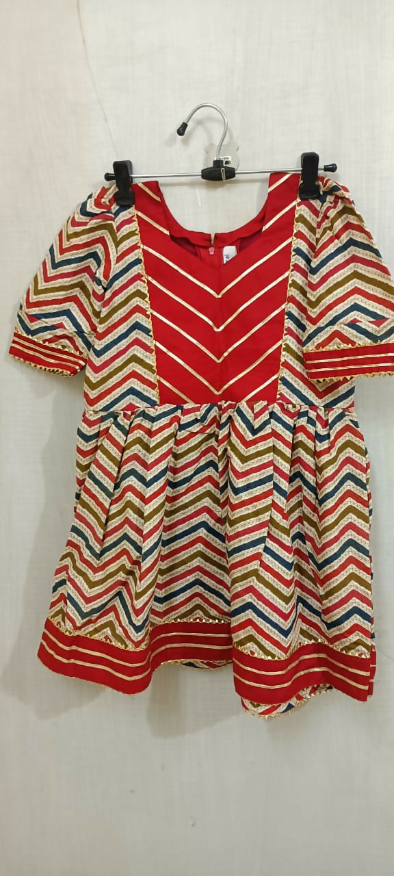 Elevate your baby girl's style with the captivating combination of red and skin color - a perfect blend of vibrancy and warmth for her adorable wardrobe