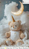 Teddy bear with unicorn horn sitting on a fluffy white surface with a moon and stars in the background.