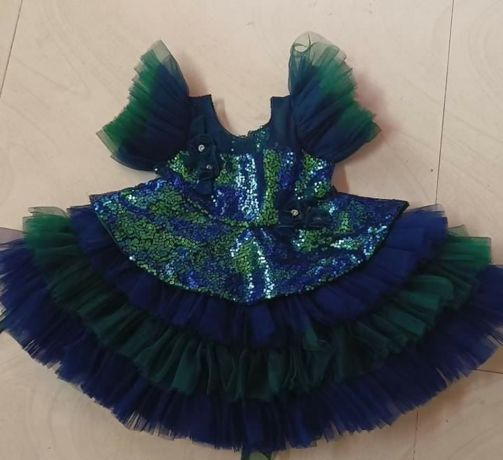 Elevate your baby girl's wardrobe with our Designer Frock/Dress, offering elegance and style for special occasions.