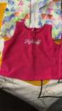 Pink sleeveless top with 'Mykraft' branding on a colorful geometric patterned background.