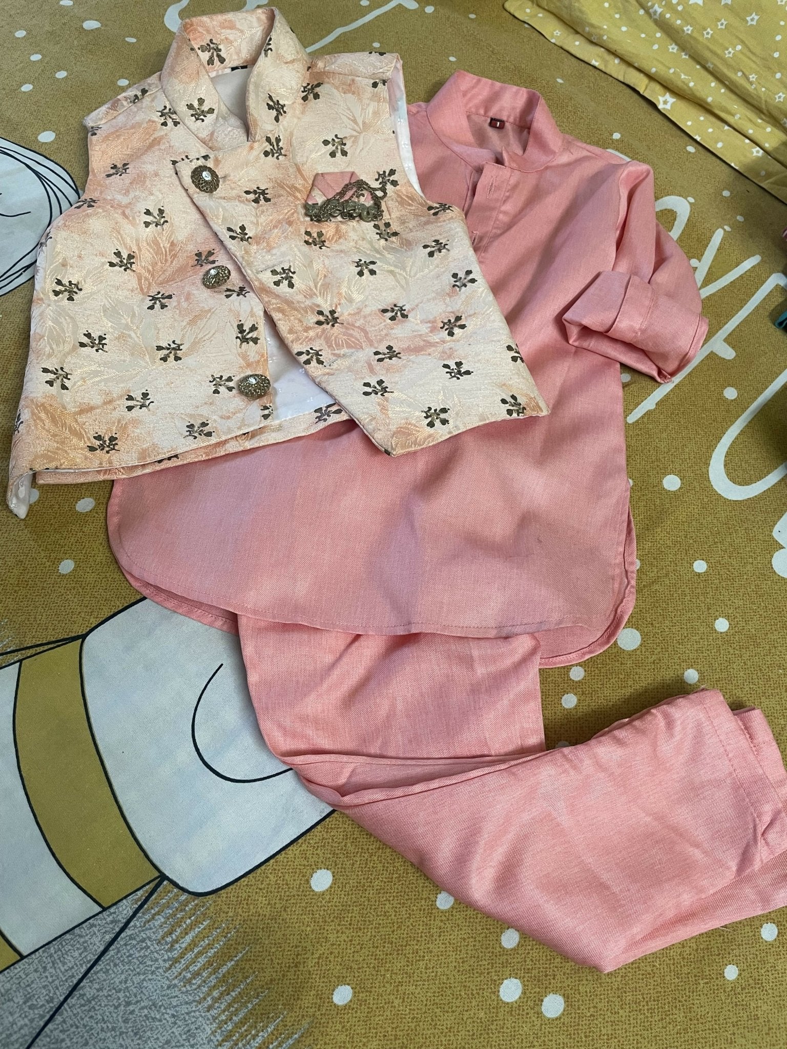 Pink traditional outfit with embroidered vest