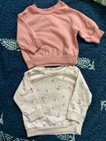 Set of 2 baby sweatshirts (H&M & Lullaby Baby) – warm, soft, and stylish for 0–5 months.