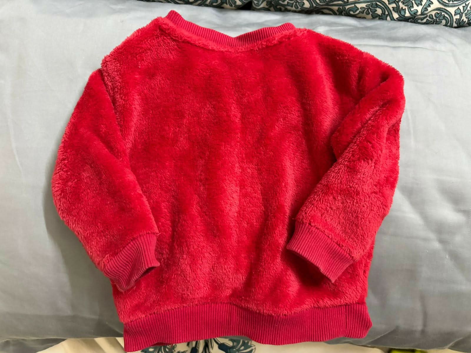 Wrap your little one in warmth and magic with this soft faux fur sweater from H&M’s Disney collection.