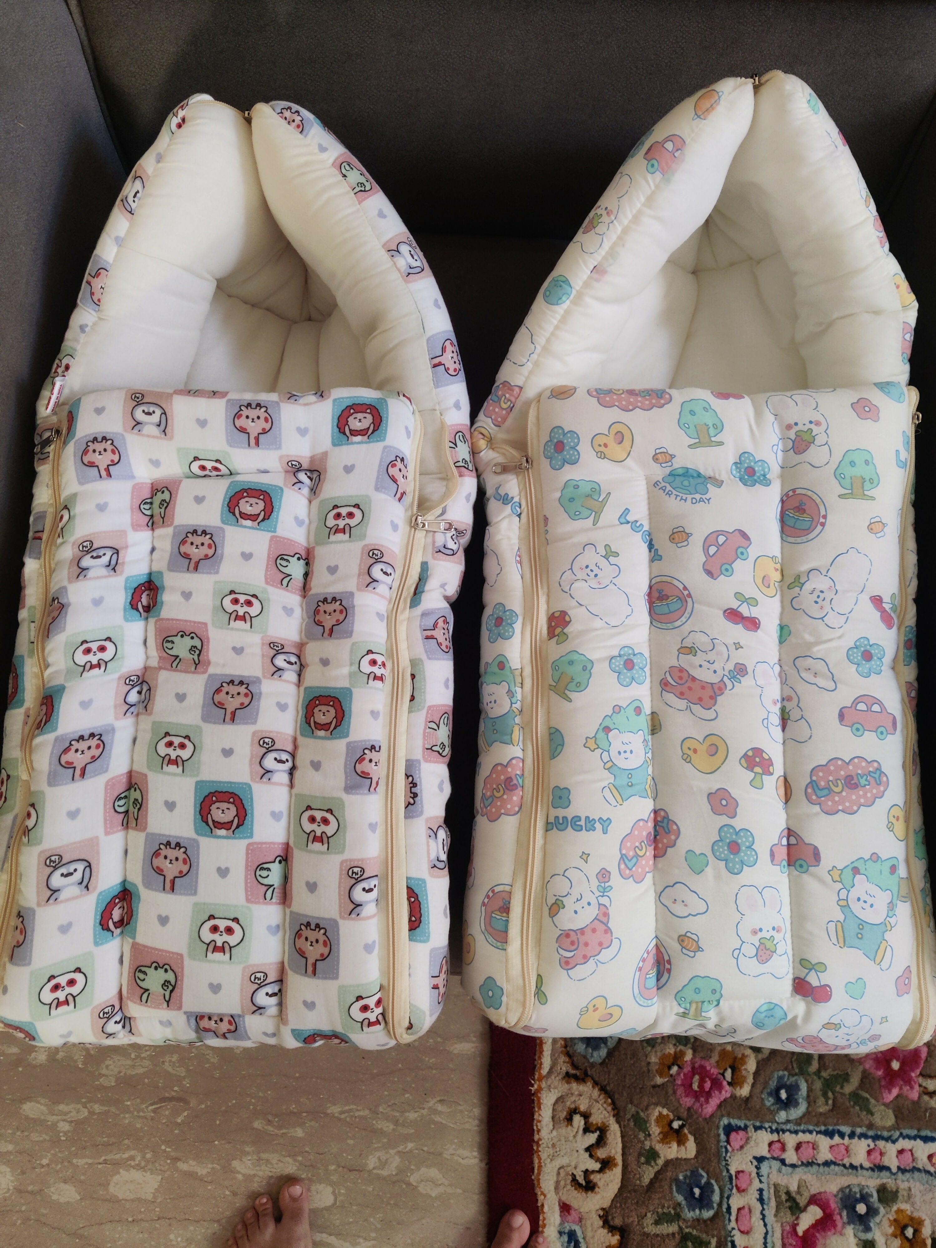 Two baby buggies with patterned covers