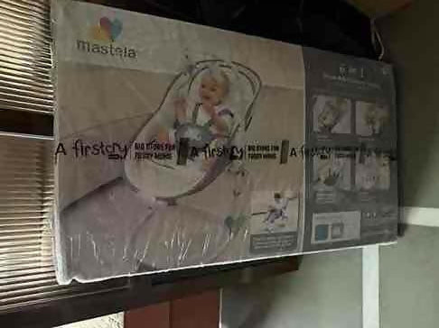 Baby carrier with brand logo on a cardboard box