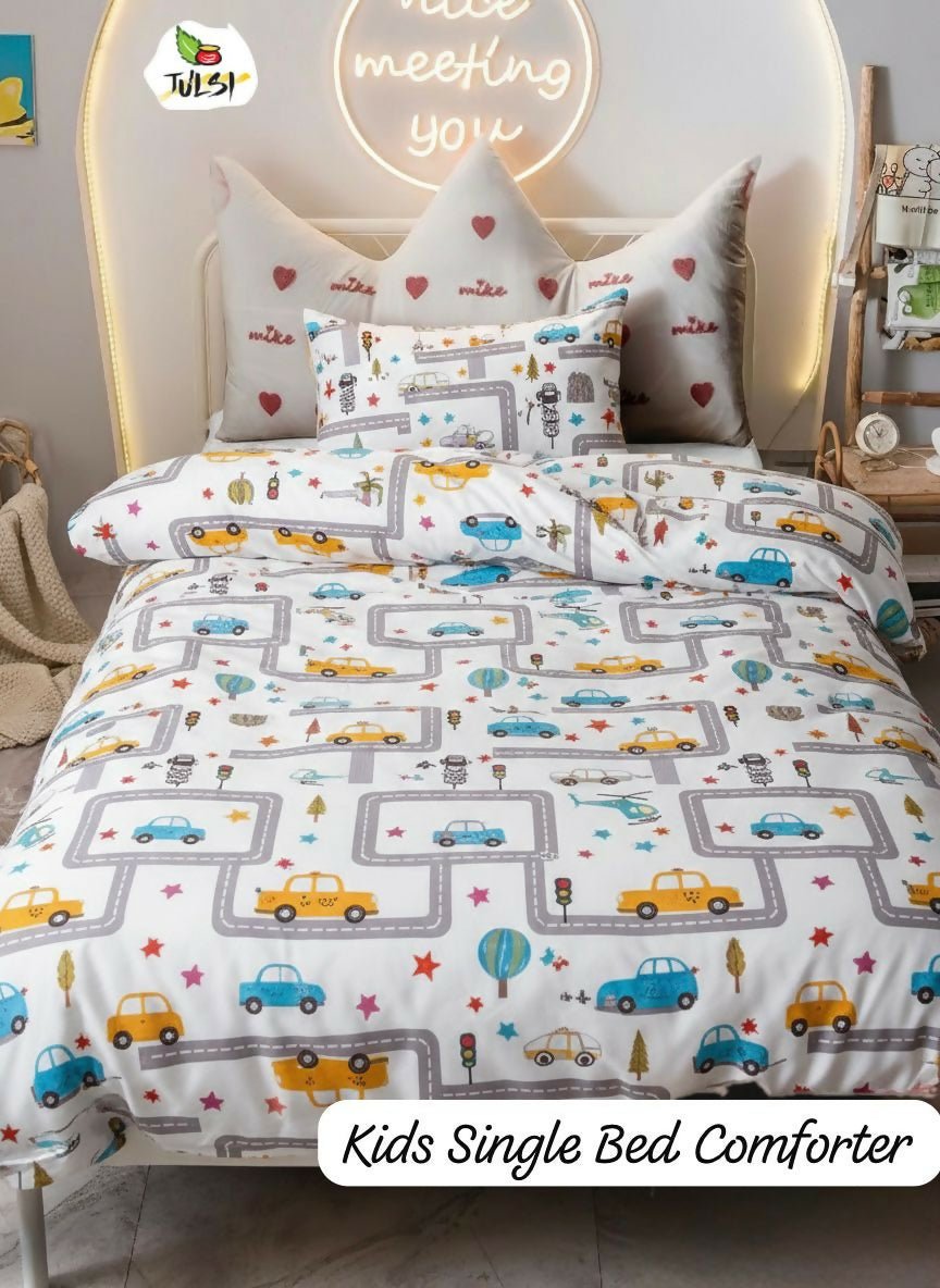 Children's single bed with a road-themed comforter and pillows