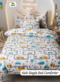 Children's single bed with a road-themed comforter and pillows