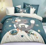 Children's bedding set with cartoon elephant design on a bed
