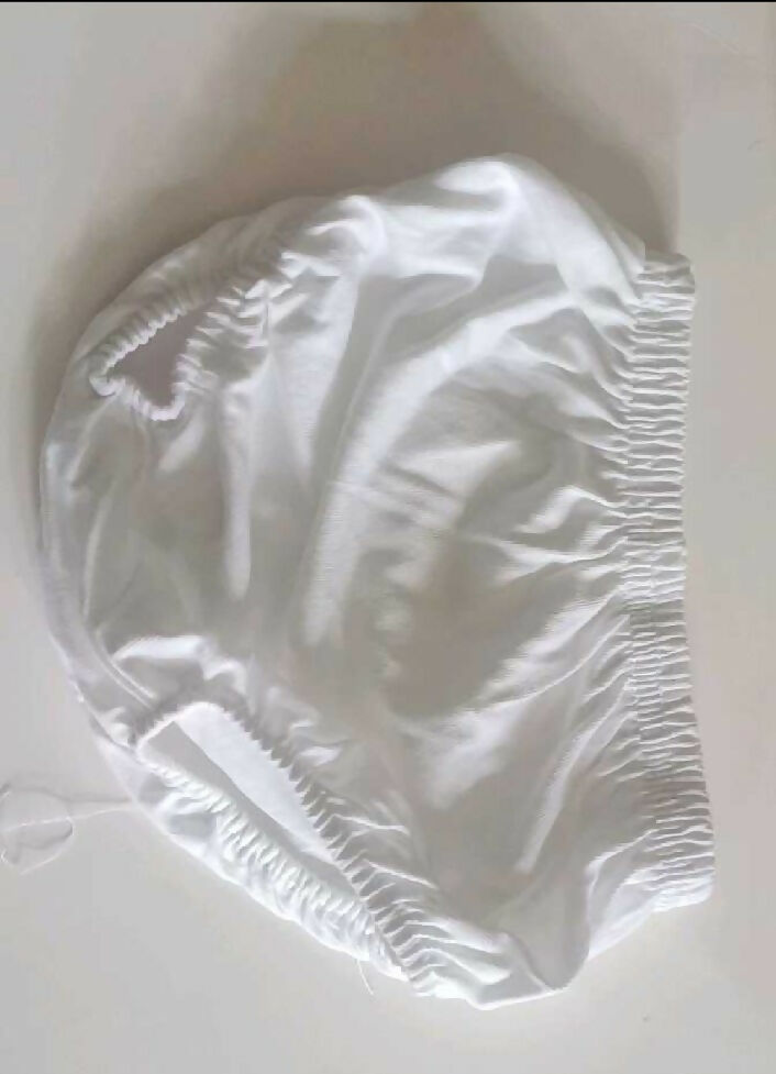 White shower cap on a white background