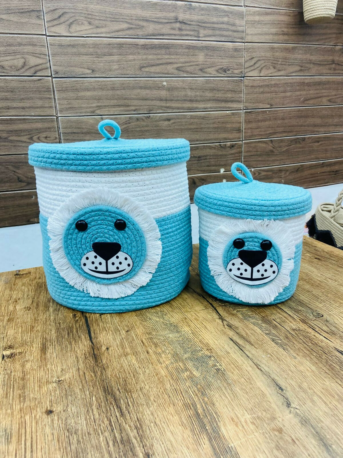 Two blue and white bear-themed storage baskets
