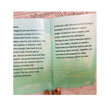 Open book with text on a pink textured background