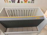 IKEA Sundvik white baby cot with mattress, fitted sheets and cot bumpers, almost new condition, convertible toddler bed design