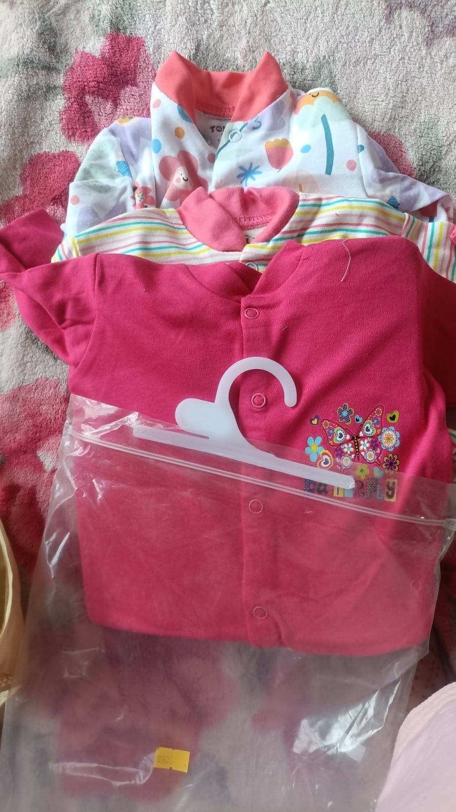 Set of 3 baby rompers in pink and multicolor prints, soft fabric, almost new condition