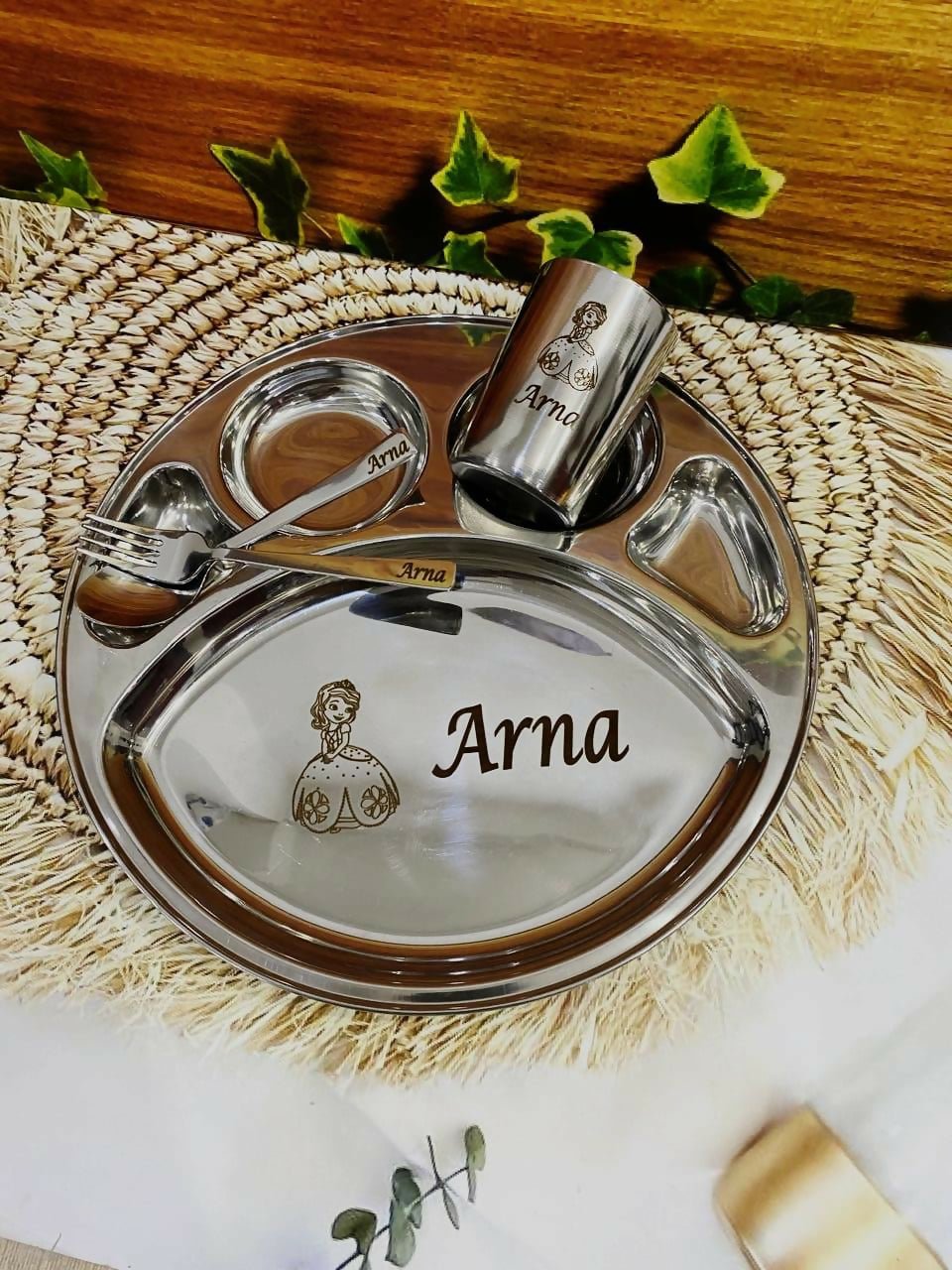 Kids personalized thali set in stainless steel with divided plate, matching engraved utensils and glass, ideal for gifting.