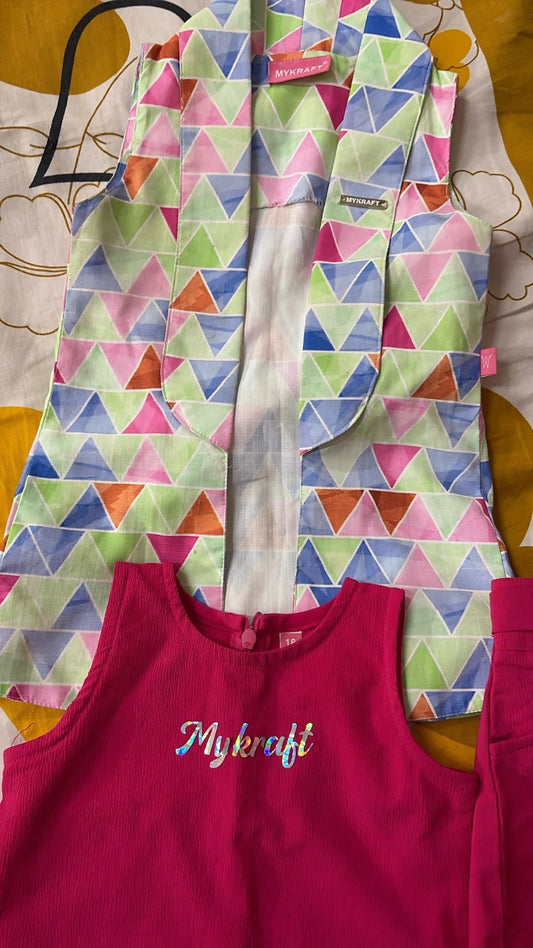 Colorful geometric-patterned jacket over a pink garment with 'My craft' text on a patterned background