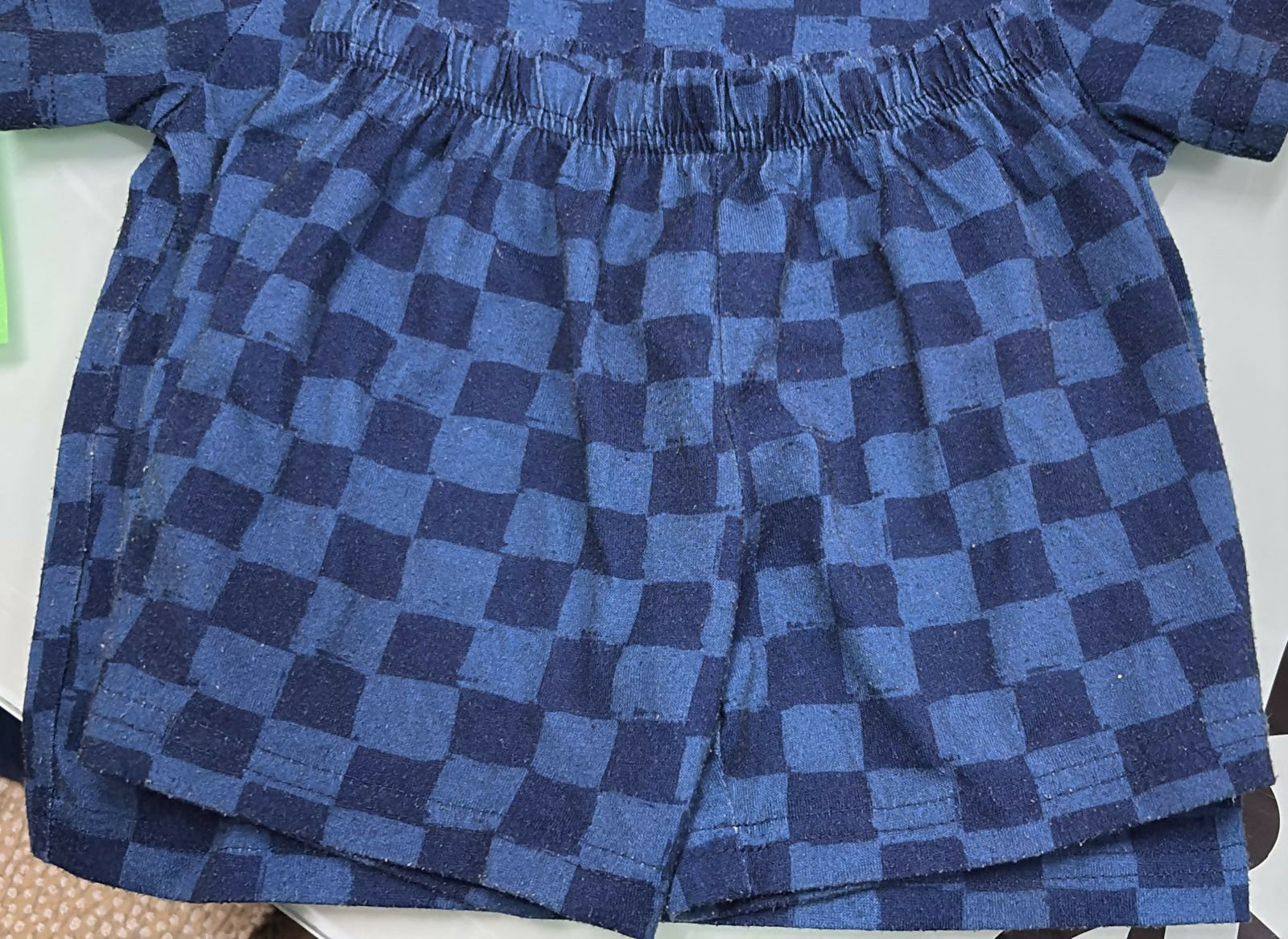 Blue checkered fabric on a white background