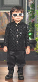 Child wearing a black sequined outfit