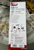 Luvlap Adore Electric Breast Pump packaging with detailed contents list on a floral tablecloth.