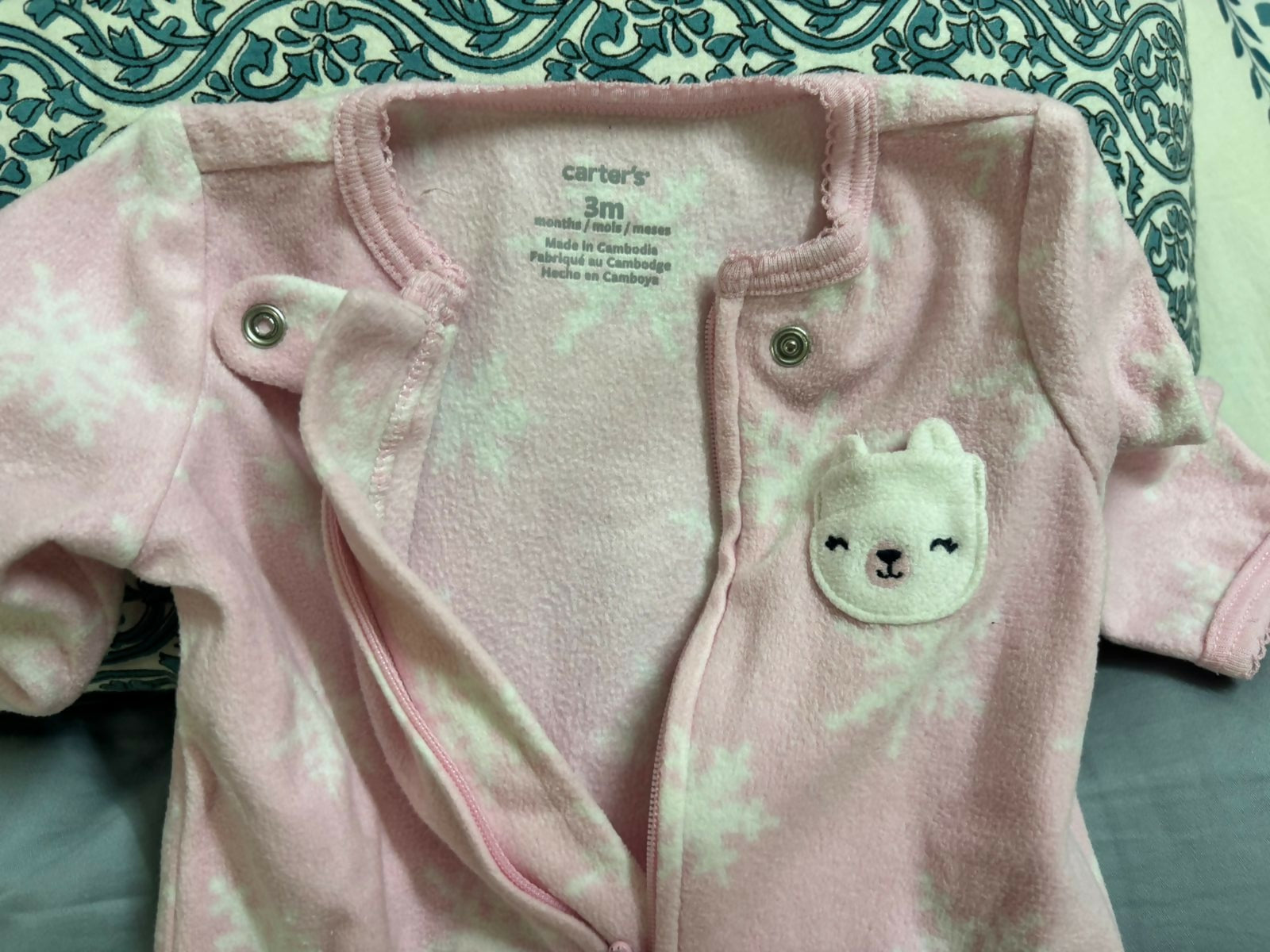 Keep your baby snug and warm during chilly nights with this set of 2 fleece sleepsuits from Carter’s.