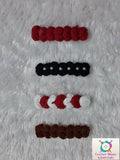 Set of red, black, white, and brown hair ties