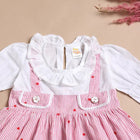 Children's dress with red polka dots 