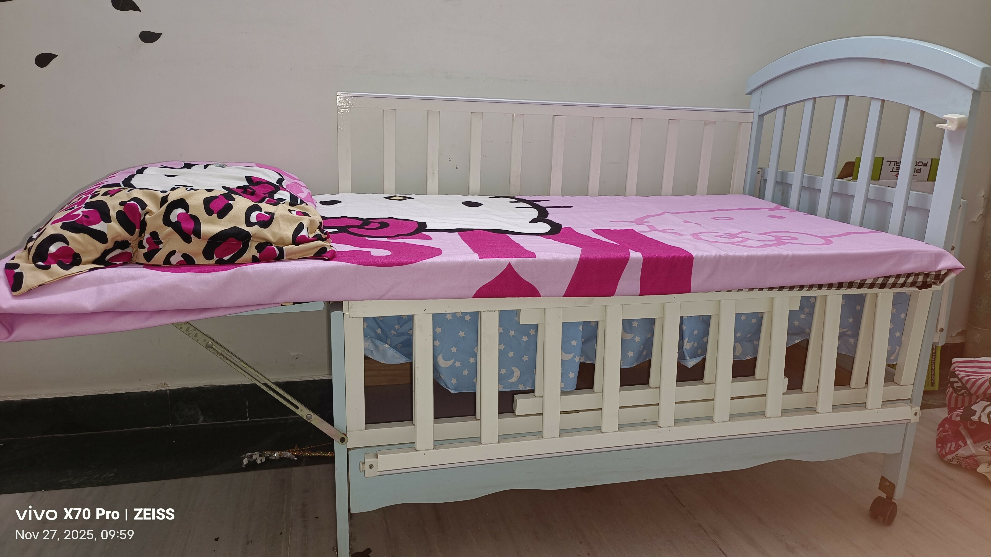 Blue baby cot with mattress and side protector