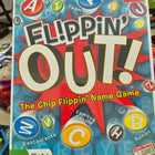 Board game box titled 'Flippin' Out!' with colorful letters 