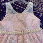 Adorn your baby girl in this elegant Pearl and Lace Work Frock, perfect for making precious memories!






