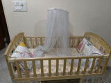 Star & Daisy 12 in 1 Baby Wooden Cot Bed, Convertible Manual Cradle with Mattress, Bumper Set, Mosquito Net & Adjustable Stand (Natural Wood | With Mattress & Bumper Set)