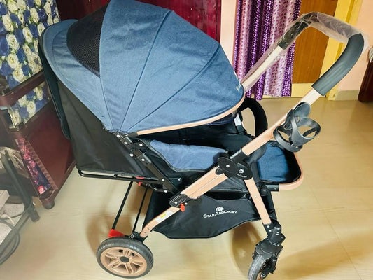 Experience comfort and convenience with the STAR AND DAISY Stroller/Pram for Baby, featuring a spacious seat, adjustable canopy, and one-hand folding mechanism for easy travel and storage.